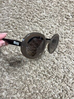 Miu Miu Glossy Round Sunglasses in Taupe and Black
